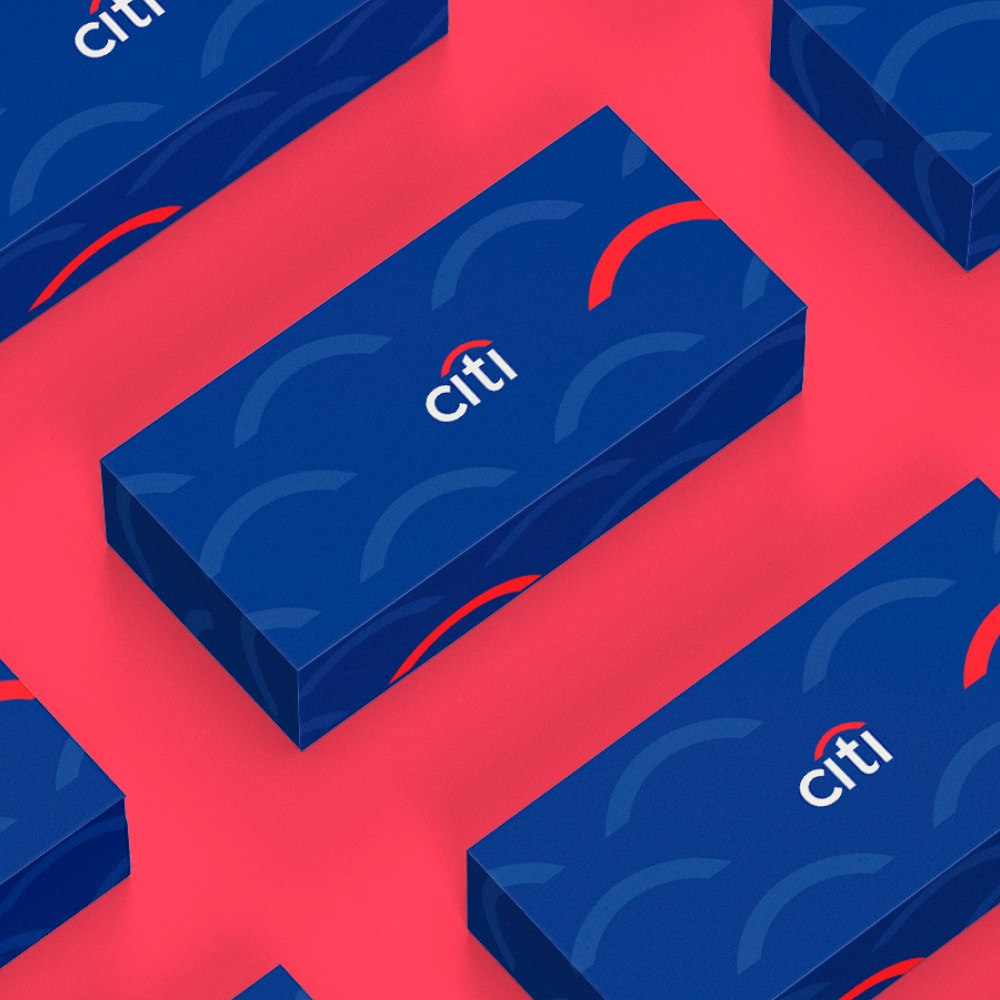 Full service 7 Blue gift boxes with a pattern of semicircles and the word citi are arranged on a pink surface. Each box features a red arc above the brand name, showcasing an eye-catching design subscription style.